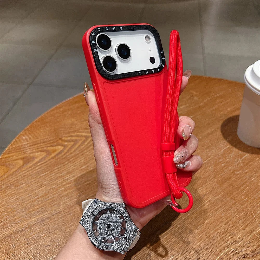 For iPhone 18 Pro Max / 17 Pro Max Case Black Lens Frame Shockproof TPU PC Phone Back Cover with Wrist Strap - Red - 1